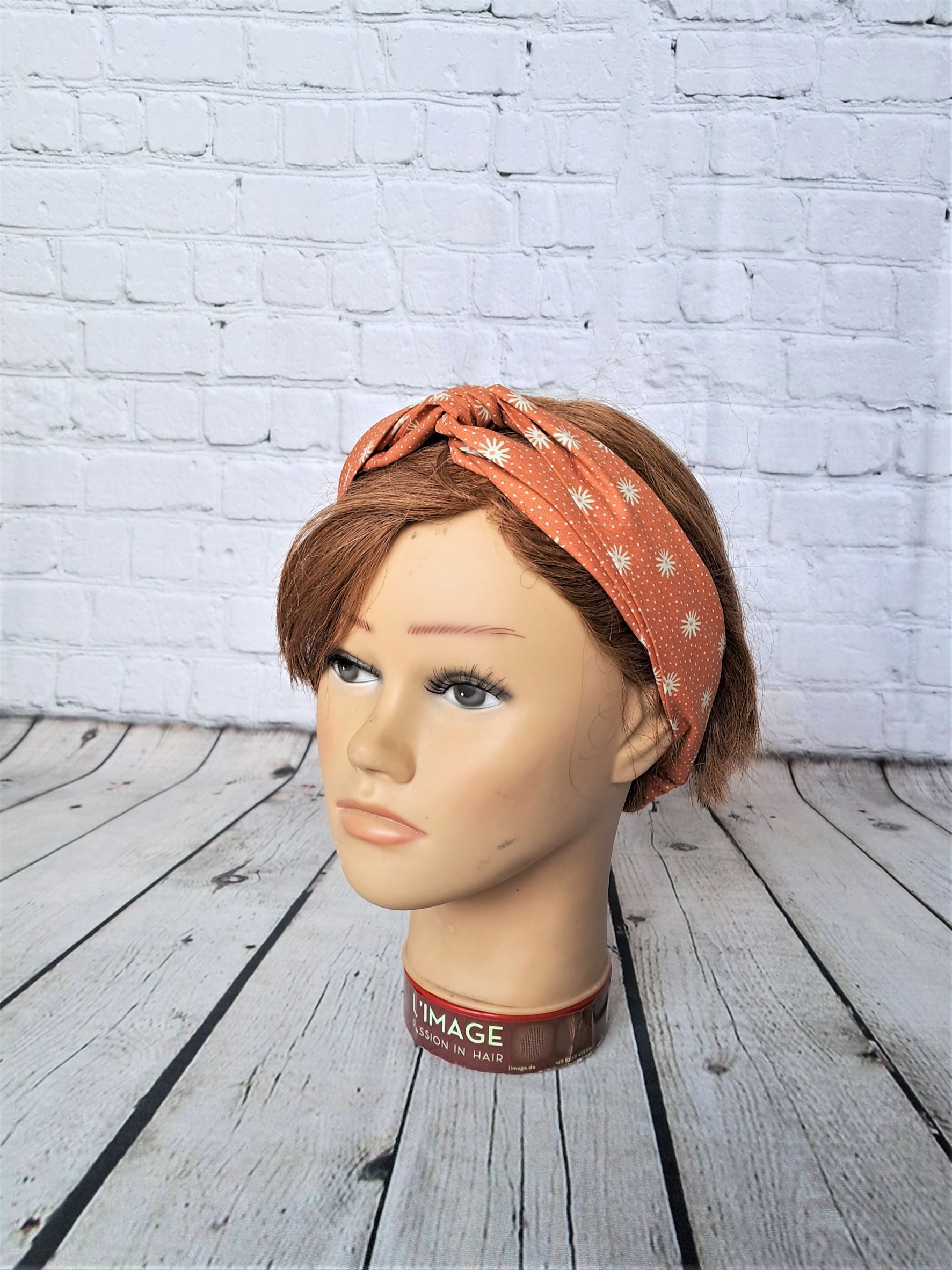 Diadema elástica naranja con soles